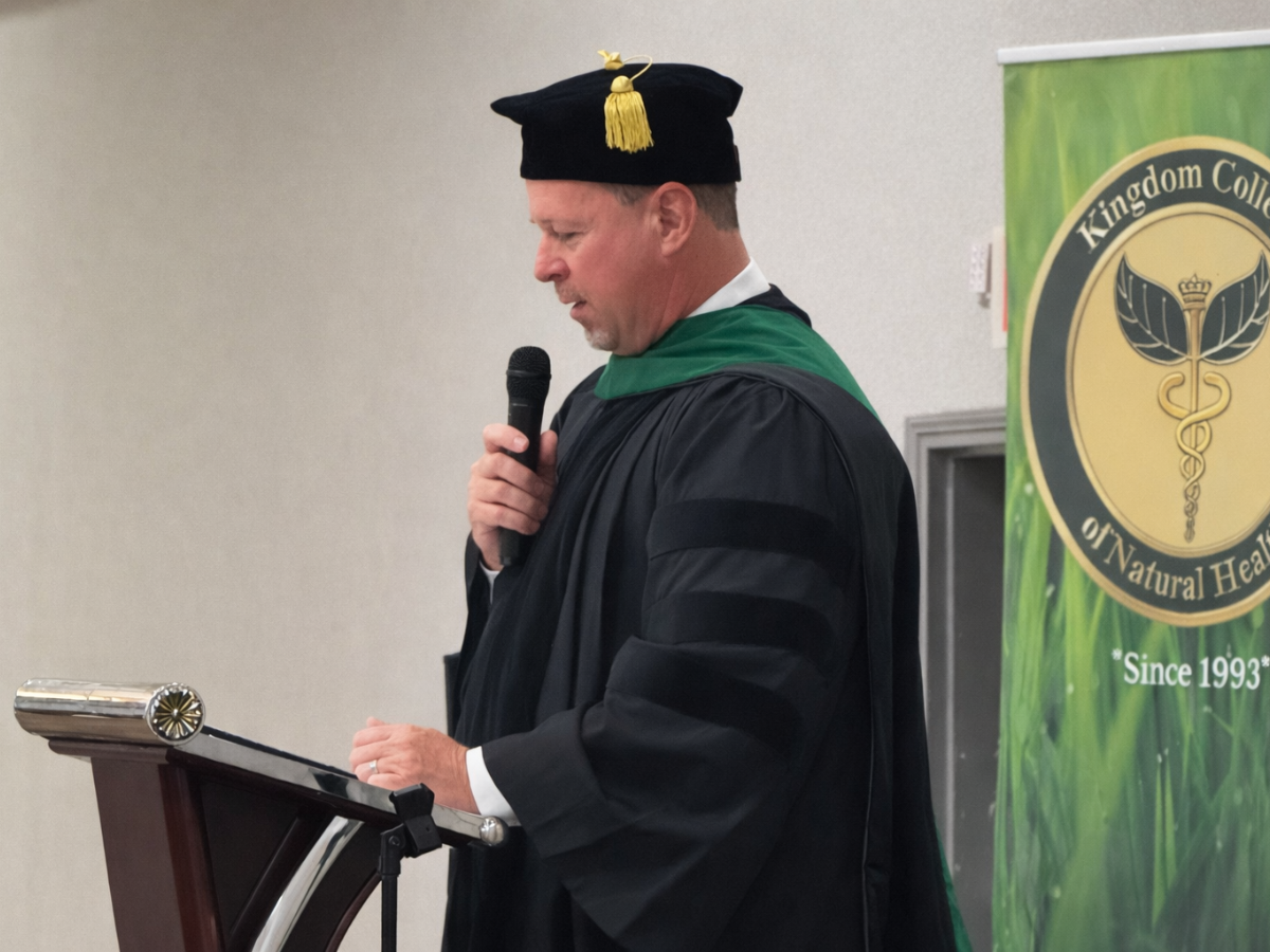 Dr. Stacy Kimmel speaking at graduation podium